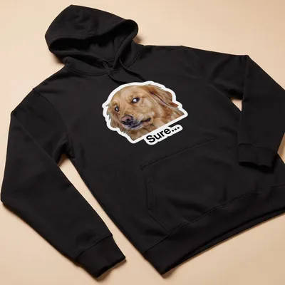 Meme style t-shirt featuring a cheerful Golden Retriever with the text 'Sure...' — printed on a unisex hoodie