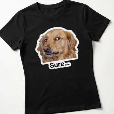 Meme style t-shirt featuring a cheerful Golden Retriever with the text 'Sure...' — printed on a women's shirt