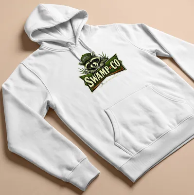 Vintage-style t-shirt featuring a raccoon and the text 'SWAMP·CO BORN IN THE SWAMP'. — printed on a unisex hoodie