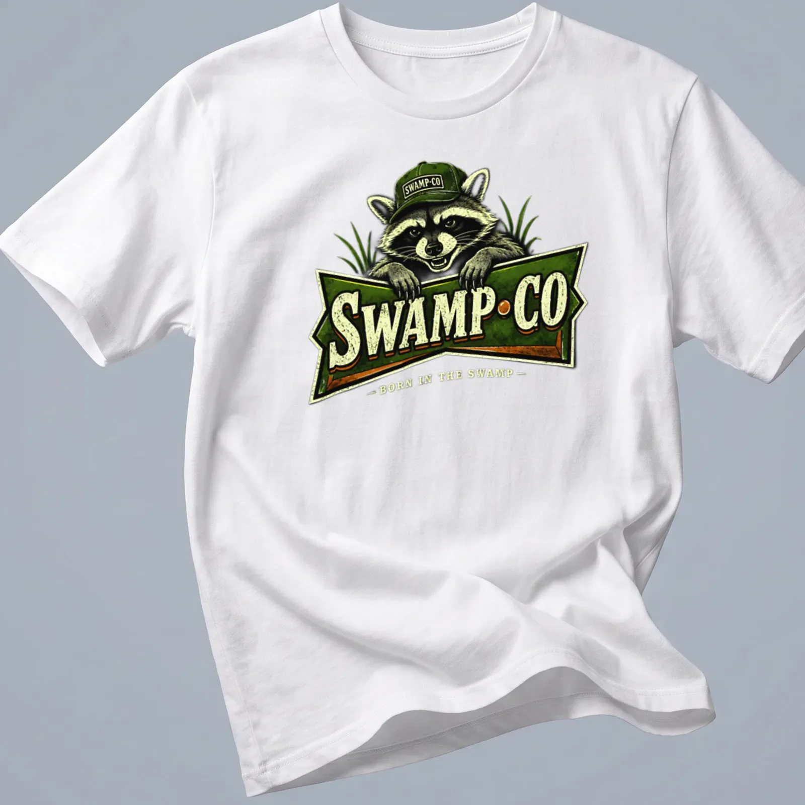 Vintage-style t-shirt featuring a raccoon and the text 'SWAMP·CO BORN IN THE SWAMP'. — printed on a unisex t-shirt