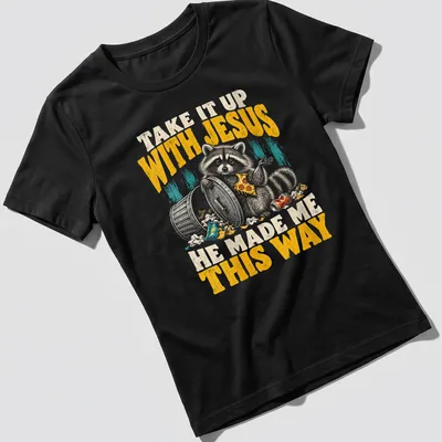 Vintage distressed Raccoon tee with humorous text about embracing individuality — printed on a women's shirt