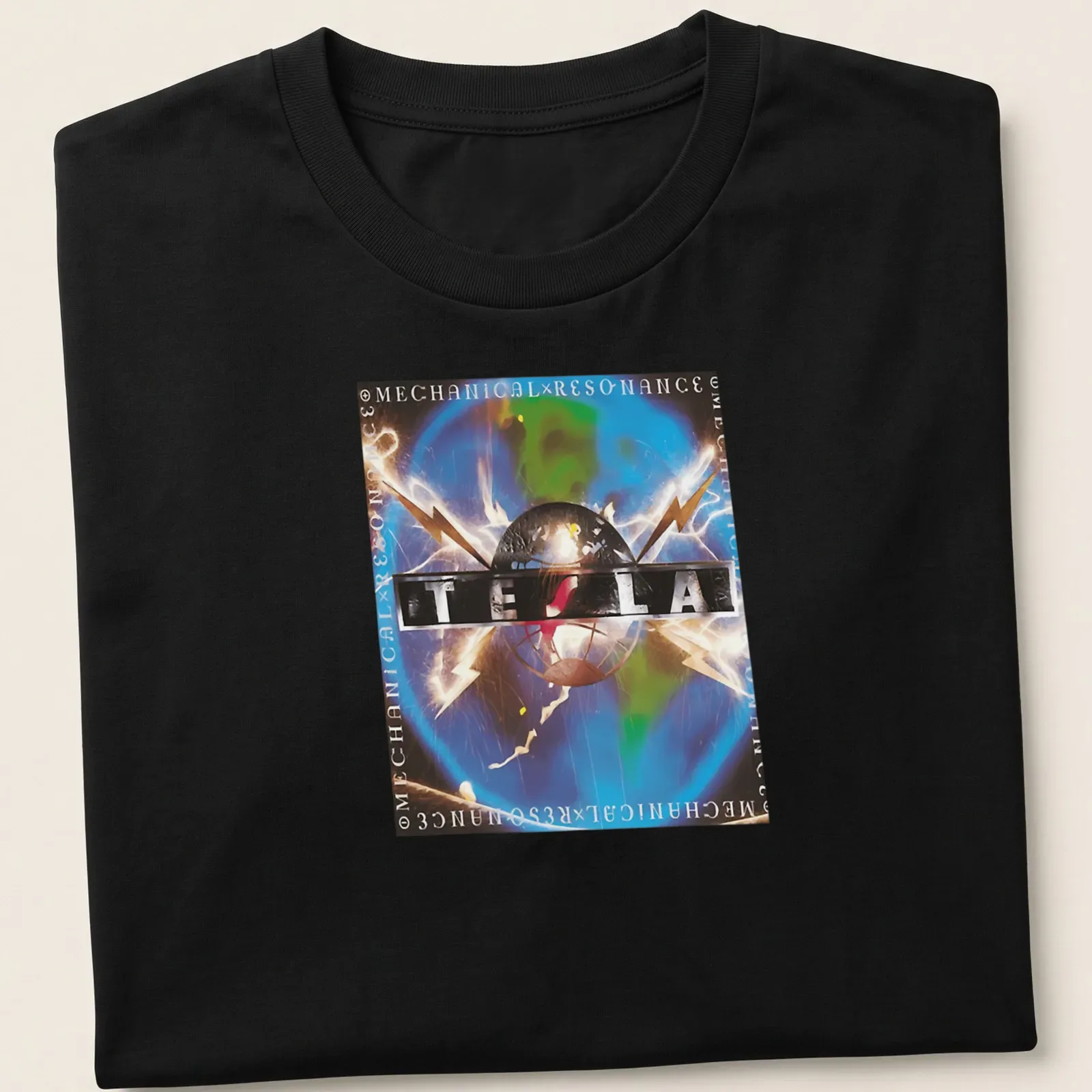 Vibrant graphic featuring Tesla logo with electric sparks in multiple colors — printed on a unisex t-shirt