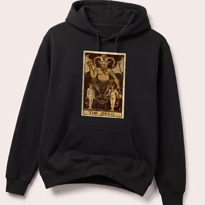 Vintage distressed t-shirt featuring The Devil tarot card design with bold text. — printed on a unisex hoodie