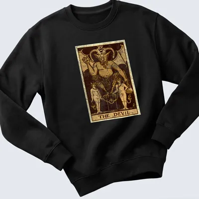 Vintage distressed t-shirt featuring The Devil tarot card design with bold text. — printed on a unisex sweatshirt