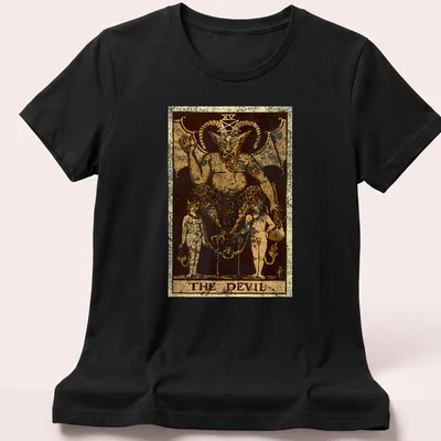 Vintage distressed t-shirt featuring The Devil tarot card design with bold text. — printed on a women's shirt