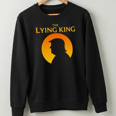 Minimalist silhouette of a man with text 'THE LYING KING' in orange and yellow — printed on a unisex sweatshirt