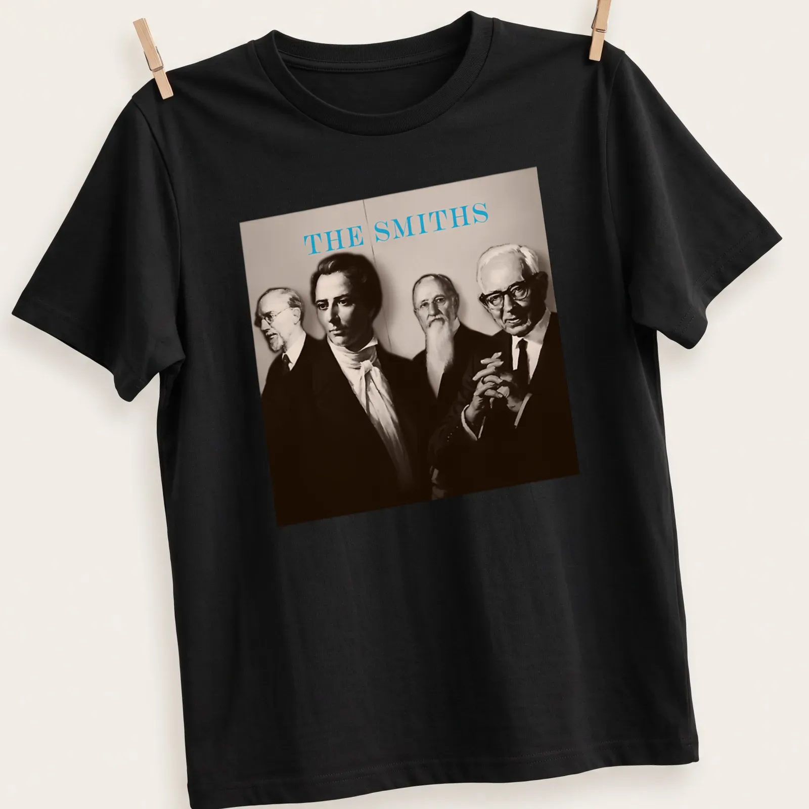 Sepia portrait of four figures with the text 'THE SMITHS' in light blue — printed on a unisex t-shirt