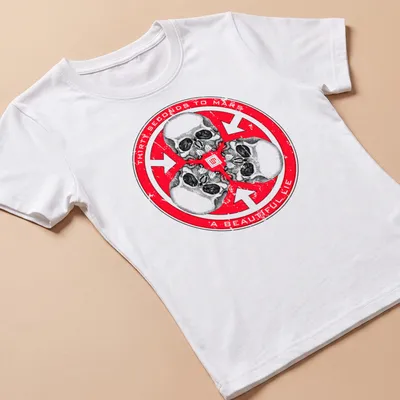 Distressed T-shirt featuring three skulls and the text Thirty Seconds to Mars A Beautiful Lie — printed on a women's shirt