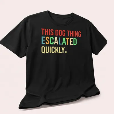 Bold colorful typography shirt featuring playful dog quote — printed on a unisex t-shirt (angled view)