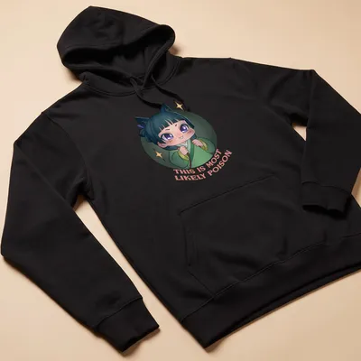 Kawaii character t-shirt with playful text 'THIS IS MOST LIKELY POISON' in vibrant colors — printed on a unisex hoodie