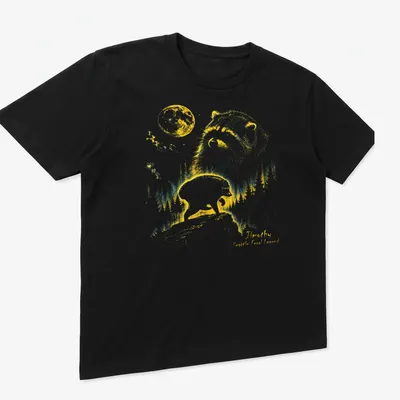 Retro T-shirt featuring a raccoon under a crescent moon with playful text. — printed on a unisex t-shirt (angled view)