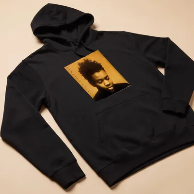Photographic portrait of Tracy Chapman with her name beneath in bold lettering — printed on a unisex hoodie