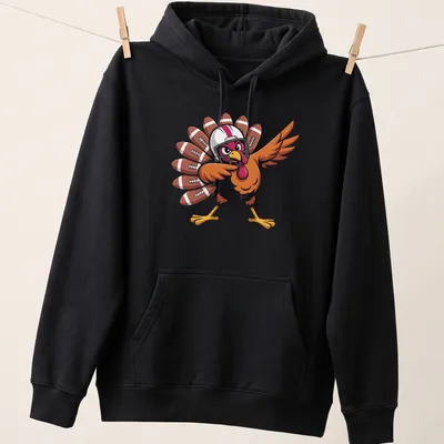Cartoon turkey playing football in brown, orange, and red colors — printed on a unisex hoodie