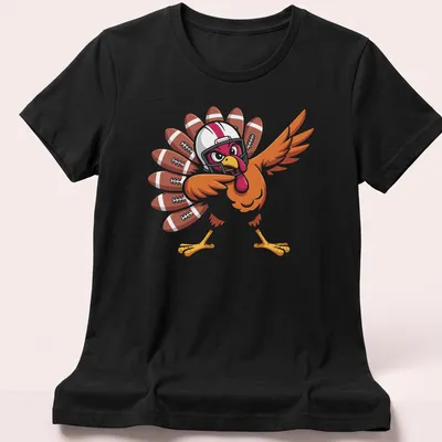 Cartoon turkey playing football in brown, orange, and red colors — printed on a women's shirt