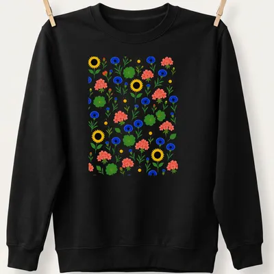 Colorful floral pattern featuring sunflowers and cornflowers in vibrant colors — printed on a unisex sweatshirt