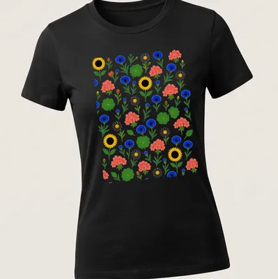 Colorful floral pattern featuring sunflowers and cornflowers in vibrant colors — printed on a women's shirt