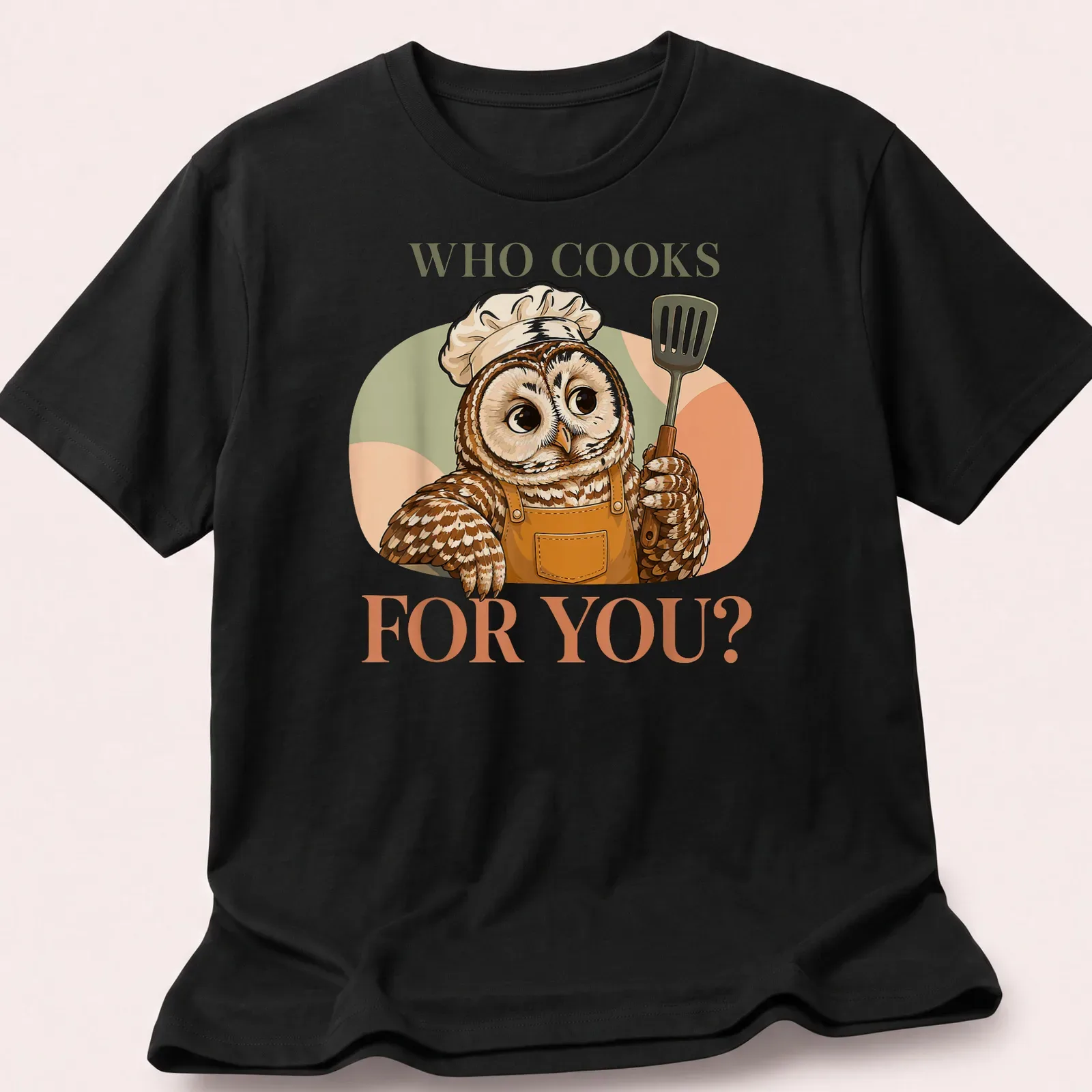 Cute owl chef stirring a pot with the text 'Who Cooks For You?' — printed on a unisex t-shirt