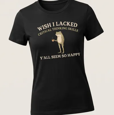Illustration of a frog holding a cup beside humorous text about critical thinking — printed on a women's shirt