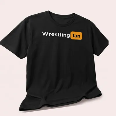 Bold typography Wrestling Fan T-shirt in black, orange, and white — printed on a unisex t-shirt (angled view)